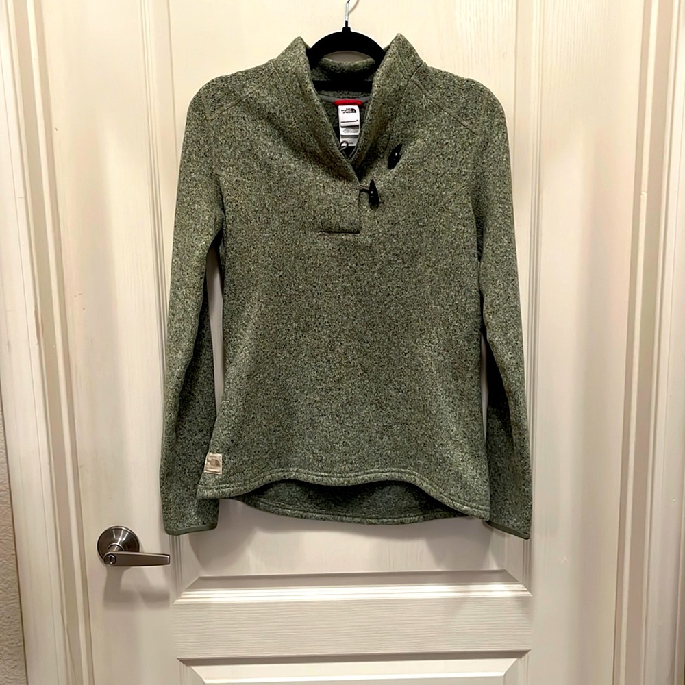 Fleece lined fitted green sweater with tusk look a like “buttons”.